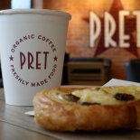 Article thumbnail: FILE PHOTO: A coffee and a pastry are seen on a table inside a Pret A Manger store in Liverpool, Britain, September 22, 2021. REUTERS/Phil Noble/File Photo