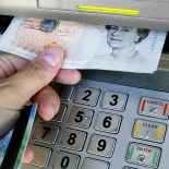 Article thumbnail: File photo dated 06/04/06 of a person using a cashpoint. Nine new banking hubs have been recommended by ATM network Link, under an initiative to help maintain the cash network. Banking hubs are a shared banking space on the high street, with dedicated rooms where customers can see community bankers from their own bank. Issue date: Friday January 27, 2023. PA Photo. The community bankers work on rotation, with a different banking provider available on each day of the week. See PA story MONEY Cash. Photo credit should read: Gareth Fuller/PA Wire