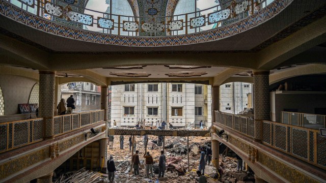 Article thumbnail: Plain-clothed policemen gather over the rubble of a damaged mosque following January's 30 suicide blast inside the police headquarters in Peshawar on February 1, 2023. - A suicide blast at a mosque inside a Pakistan police headquarters was a targeted revenge attack, a police chief said, as rescue efforts ended with the death toll standing at 100. (Photo by Abdul MAJEED / AFP) (Photo by ABDUL MAJEED/AFP via Getty Images)