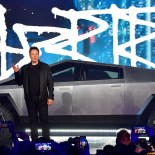 Article thumbnail: (FILES) Tesla co-founder and CEO Elon Musk introduces the newly unveiled all-electric battery-powered Tesla Cybertruck at Tesla Design Center in Hawthorne, California on November 21, 2019. The US transition to electric cars has hit a speed bump, with concerns about vehicle range and limited charging capacity adding to core affordability issues. Automakers in recent weeks have pushed back EV sales targets and delayed capital projects as they seek to reduce inventories of unsold EVs at dealerships. (Photo by Frederic J. BROWN / AFP) (Photo by FREDERIC J. BROWN/AFP via Getty Images)