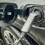 Article thumbnail: BATH, UNITED KINGDOM - FEBRUARY 25: A electric car is charged by a wall charger in a city centre car park, on February 25, 2024 in Bath, England. The government's commitment to reducing future Co2 carbon emissions will mean many more motorists will need to switch from petrol and diesel powered cars to electric (EV) driven ones. However there are also fears that the charging network in the UK is not yet fit to deal with the enormous demand more EVs on the road would place on it.(Photo by Matt Cardy/Getty Images)