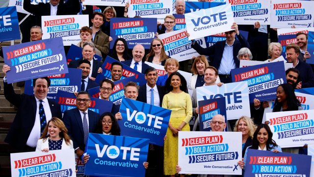 Conservative supporters posing with then-prime minister Rishi Sunak (Photo by BENJAMIN CREMEL/POOL/AFP via Getty Images)