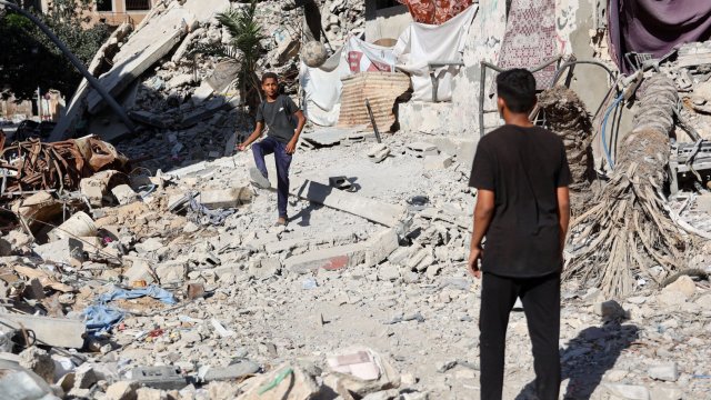 Article thumbnail: Palestinian boys play football surrounded by the rubble of buildings destroyed during previous Israeli bombardment, in Gaza City on June 10, 2024, amid the ongoing conflict between Israel and the Palestinian Hamas militant group. (Photo by Omar AL-QATTAA / AFP) (Photo by OMAR AL-QATTAA/AFP via Getty Images)