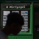 Article thumbnail: A sign for 'Sales, Lettings & Mortgages' in the window of an estate agent in Rochester, UK, on Tuesday, Aug. 15, 2023. Grocery price inflation has fallen sharply, another sign that Britain's cost-of-living crisis is gradually easing for consumers. Photographer: Hollie Adams/Bloomberg via Getty Images