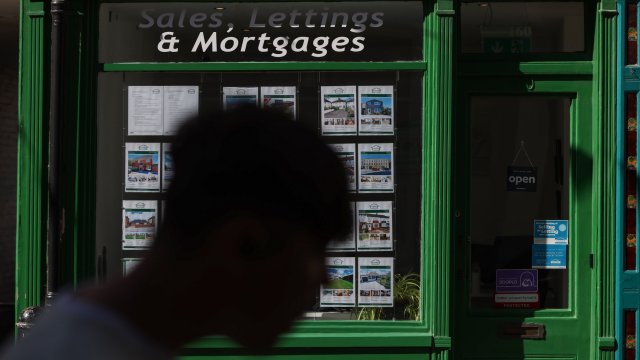 Article thumbnail: A sign for 'Sales, Lettings & Mortgages' in the window of an estate agent in Rochester, UK, on Tuesday, Aug. 15, 2023. Grocery price inflation has fallen sharply, another sign that Britain's cost-of-living crisis is gradually easing for consumers. Photographer: Hollie Adams/Bloomberg via Getty Images