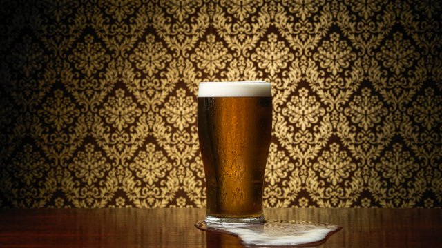 Article thumbnail: Pint of beer with overflow spillage on pub table