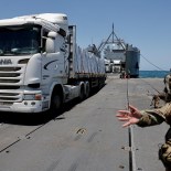 Article thumbnail: A truck carries humanitarian aid across Trident Pier, a temporary pier to deliver aid, off the Gaza Strip, amid the ongoing conflict between Israel and Hamas, near the Gaza coast, June 25, 2024. REUTERS/Amir Cohen TPX IMAGES OF THE DAY