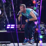 Article thumbnail: Chris Martin of Coldplay performs on the Pyramid stage (Photo: Jim Dyson/Redferns)