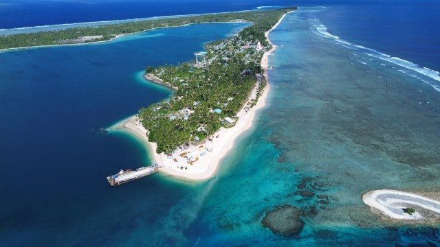 Article thumbnail: April 2024. TCDJI_0761 Nanumea atoll in Tuvalu, where new berm top barriers are being installed to prevent wave overtopping. The Tuvalu Coastal Adaptation Project construction of multimillion-dollar adaptation infrastructure in the capital Funafuti is complete. More areas set to follow soon. The reclamation incorporates drainage to protect from heavy rainfall and a small harbor facility to provide continued community access to the Funafuti Lagoon. Plans are underway to ensure the site is properly maintained, with the buried mega-bags expected to remain intact well beyond 40 years. Financed with US$36 million from the Green Climate Fund and $2.9 million from the Government of Tuvalu, the project will enable the Government to take steps to manage the risks of coastal hazards. Launched in August 2017, the Tuvalu Coastal Adaptation Project will be implemented over 7 years until 2024. ? TCAP. For more information visit: www.tcap.tv Image via https://www.flickr.com/photos/undpclimatechangeadaptation/albums/72157687817446872/ DCIM\100MEDIA\DJI_0761.JPG