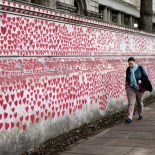 Article thumbnail: File photo dated 06/10/23 of a member of the public observing the National Covid Memorial Wall, a public mural painted by volunteers to commemorate the victims of the COVID-19 pandemic in the United Kingdom, opposite the Houses of Parliament in London. Failures to properly prepare for a pandemic in the UK are expected to be laid bare on Thursday as the UK Covid-19 Inquiry publishes its first report, which is expected to highlight the UK's focus on preparing for a flu pandemic instead of a coronavirus pandemic. Issue date: Thursday July 18, 2024. PA Photo. Inquiry chair Baroness Heather Hallett will report on how well the UK was able to face a deadly outbreak in the run up to 2020 when the Covid-19 pandemic swept across Britain. See PA story INQUIRY Coronavirus. Photo credit should read: Jordan Pettitt/PA Wire