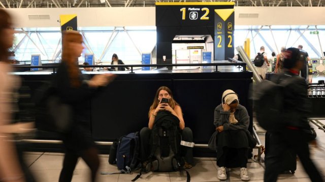 Article thumbnail: Passengers have been delayed at airports including Gatwick (Photo: Daniel Leal/AFP via Getty Images)