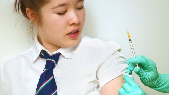 Article thumbnail: Close up of a schoolgirl having an injection