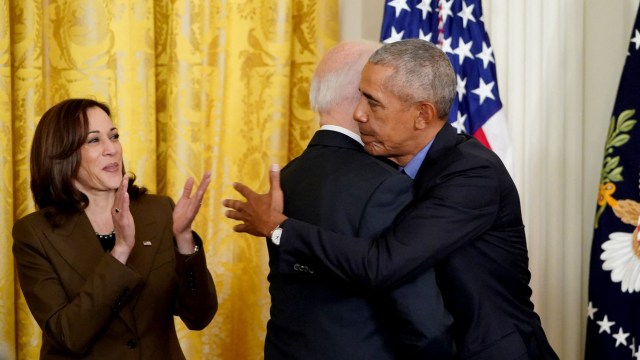 Article thumbnail: (FILES) US Vice President Kamala Harris (L) applauds as US President Joe Biden and former President Barack Obama embrace prior to delivering remarks on the Affordable Care Act and Medicaid in the East Room of the White House in Washington, DC, on April 5, 2022. US President Joe Biden announced July 21, 2024 that he is dropping out of his reelection battle with Donald Trump, in a historic move that plunges the already turbulent 2024 White House race into uncharted territory. Biden also said he was endorsing Vice President Kamala Harris as the Democratic nominee for the 2024 election after he dropped out of the race. (Photo by MANDEL NGAN / AFP) (Photo by MANDEL NGAN/AFP via Getty Images)