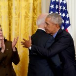 Article thumbnail: (FILES) US Vice President Kamala Harris (L) applauds as US President Joe Biden and former President Barack Obama embrace prior to delivering remarks on the Affordable Care Act and Medicaid in the East Room of the White House in Washington, DC, on April 5, 2022. US President Joe Biden announced July 21, 2024 that he is dropping out of his reelection battle with Donald Trump, in a historic move that plunges the already turbulent 2024 White House race into uncharted territory. Biden also said he was endorsing Vice President Kamala Harris as the Democratic nominee for the 2024 election after he dropped out of the race. (Photo by MANDEL NGAN / AFP) (Photo by MANDEL NGAN/AFP via Getty Images)