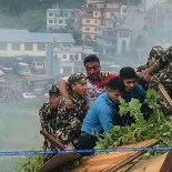 Article thumbnail: This handout photograph taken on July 24, 2024 and released by Nepal Police shows rescuers carrying the injured pilot of Saurya Airlines' plane after it crashed during takeoff at the Tribhuvan International Airport in Kathmandu. A passenger plane crashed on takeoff in Kathmandu on July 24, with the pilot rescued from the flaming wreckage but all 18 others aboard killed, police in the Nepali capital told AFP. (Photo by Nepal Police / AFP) / RESTRICTED TO EDITORIAL USE - MANDATORY CREDIT "AFP PHOTO / Nepal Police" - NO MARKETING NO ADVERTISING CAMPAIGNS - DISTRIBUTED AS A SERVICE TO CLIENTS - NO ARCHIVE (Photo by -/Nepal Police/AFP via Getty Images)