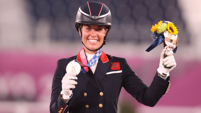 TOKYO, JAPAN - JULY 28: Bronze medalist Charlotte Dujardin of Team Great Britain poses on the podium during the medal ceremony for the Dressage Individual Grand Prix Freestyle Final on day five of the Tokyo 2020 Olympic Games at Equestrian Park on July 28, 2021 in Tokyo, Japan. (Photo by Julian Finney/Getty Images)