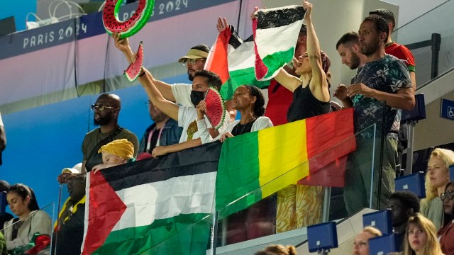 Supporters react as they watch the men's group D match between Israel and Mali at the Parc des Princes during the 2024 Summer Olympics, Wednesday, July 24, 2024, in Paris, France. (AP Photo/Rebecca Blackwell)