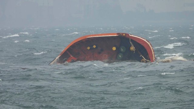 In this photo provided by the Philippine Coast Guard, Philippine-flagged motor tanker Terra Nova sinks in Manila Bay, Philippines Thursday, July 25, 2024. The oil tanker sank in Manila Bay early Thursday after encountering huge waves and the coast guard is now assessing the vessel for a leak that could cause a major spill that could reach the capital Manila, Philippine's coast guard said. (Philippine Coast Guard via AP)